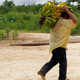 A Tsimané man carrying bananas.